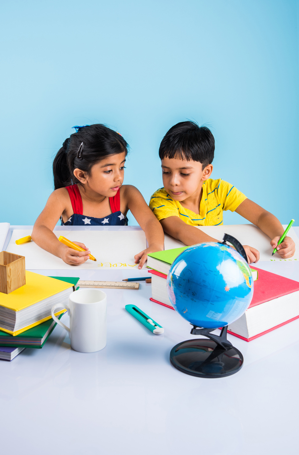 indian kids studying on study table